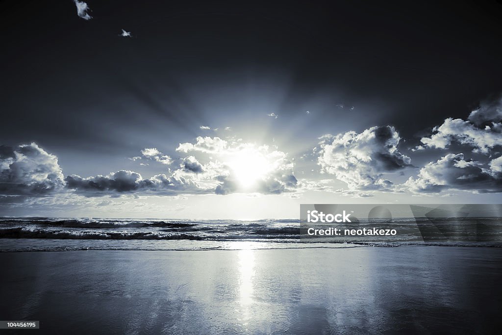 Dark sunrise  Beach Stock Photo