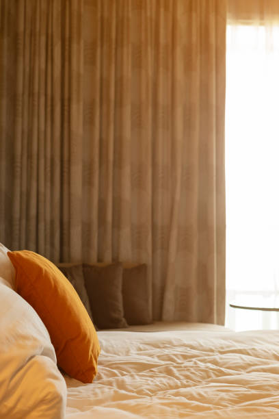 istock pillows on bed and luxury bedrooms with flare light 1044580274