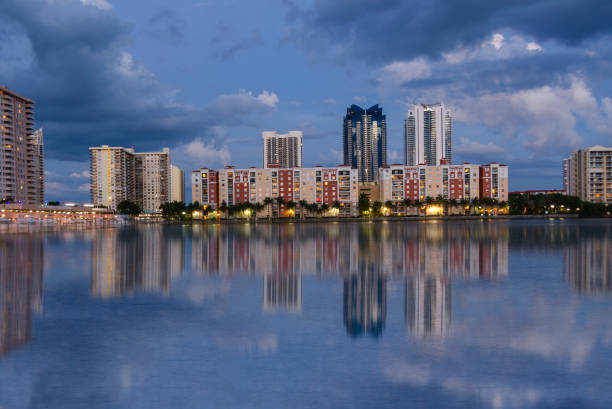 istock Miami Skyline with canal reflection during night time 1044586456