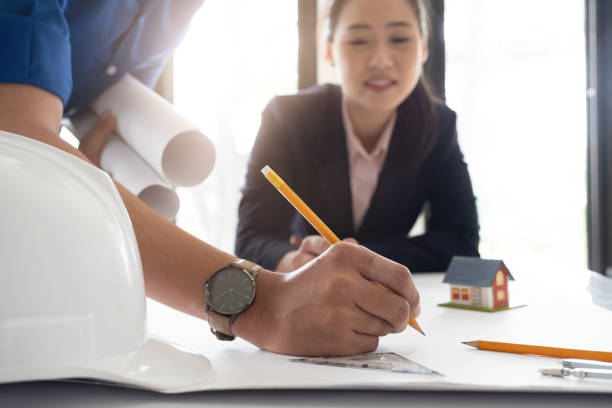 istock Image of engineer meeting for architectural project. working with partner and engineering tools on workplace. 1044605268