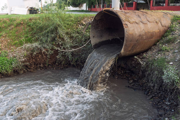 Dirty sewage from the pipe, environmental pollution stock photo