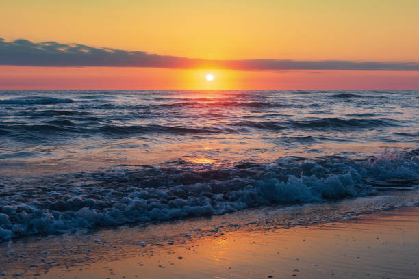 istock Amazing beautiful sunrise at the sea 1044610536