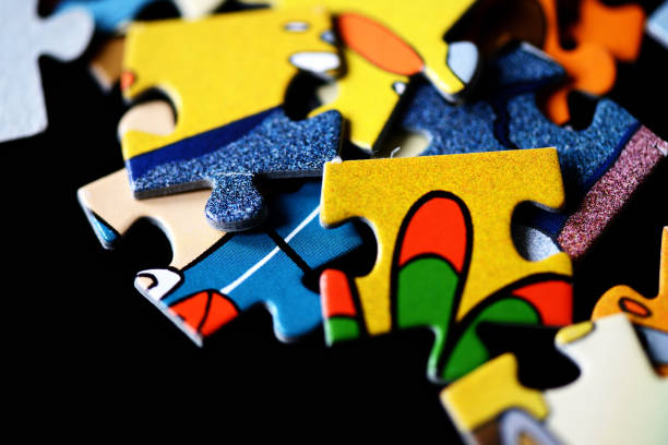 istock Children's puzzles scattered on a dark background close up 1044617316