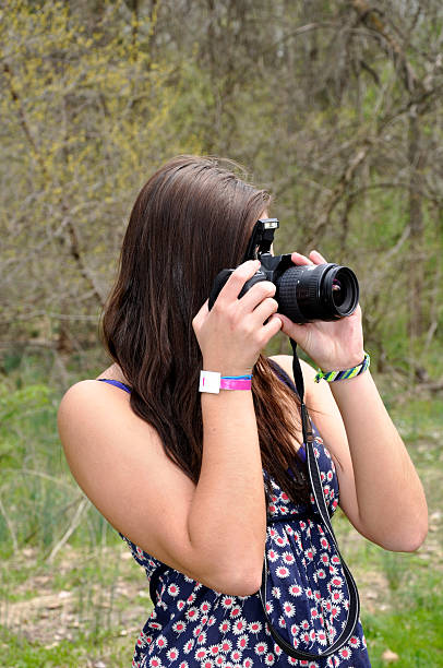 istock teen girl with a camera 104462470