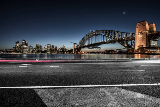 istock urban road by Sydney Harbor Bridge 1044631560