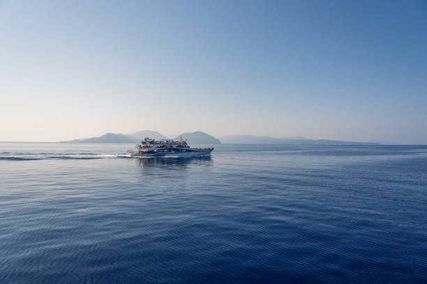 Tourist ship passing by beautiful Lefkada coast.
