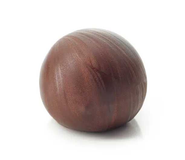 chocolate truffle ball macro isolated on a white background