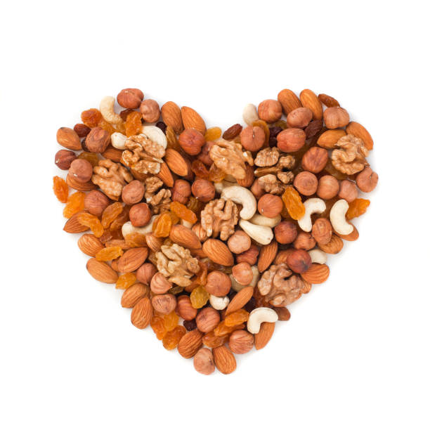 istock Different nuts stacked in the shape of a heart 1044651572