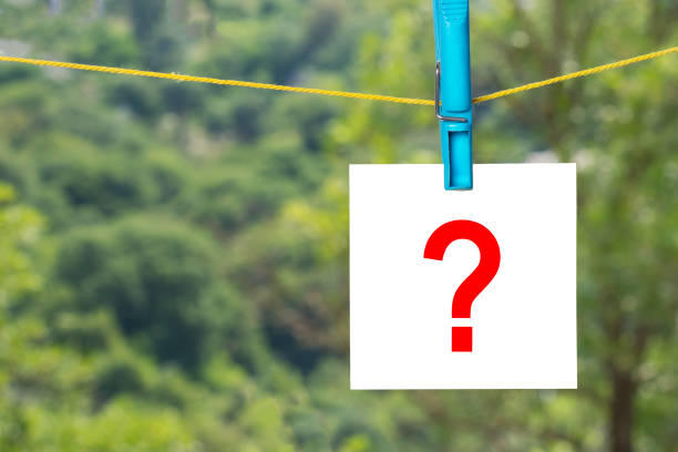 istock Paper sticker on clothespin with question mark 1044653756