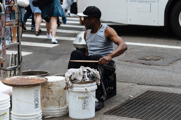 New York City, USA - June 22, 2018: Black man playing drums in New York city street