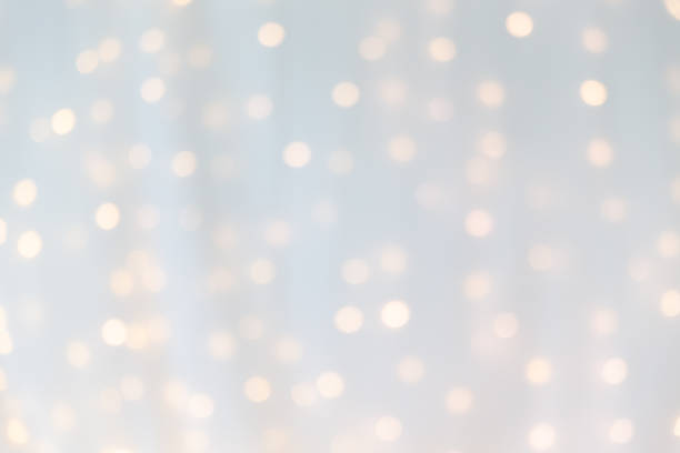 bokeh of yellow led light under curtain. stock photo