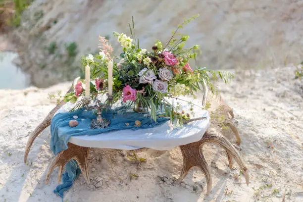 A beautiful wedding bouquet lies on the nature, on the table