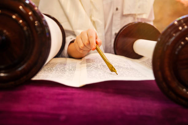 istock Bar Mitzvah boy reading from the Torah 1044663276