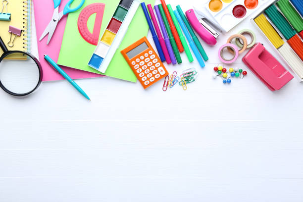 istock School supplies on white wooden table 1044663966