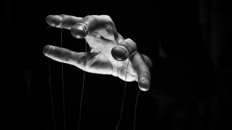 Eerie puppeteer hands controlling you. Manipulation concept