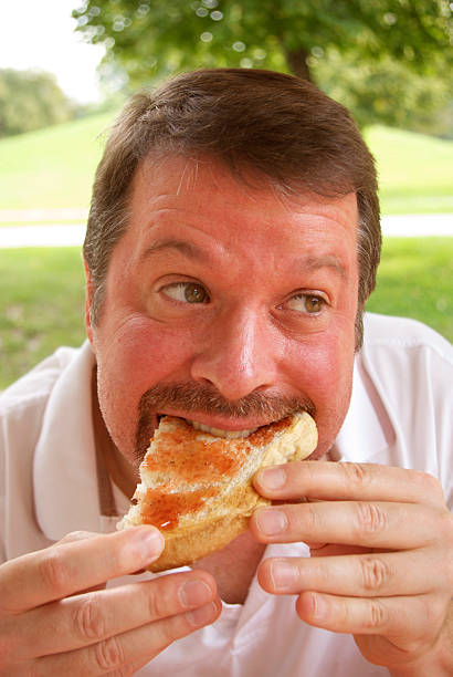 istock Man eating jellied bread 104466981