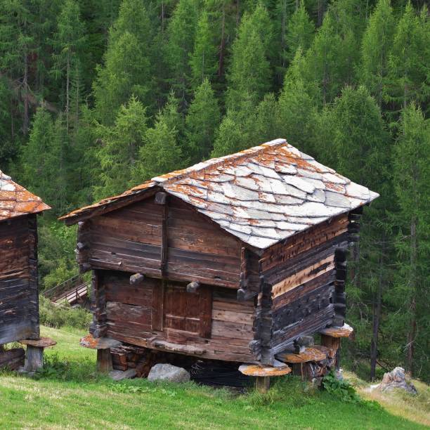 istock old timber shed with stone roofs. 1044674740