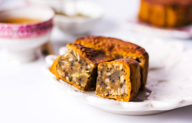 istock Chinese Mooncake with tea isolated on white background 1044681518