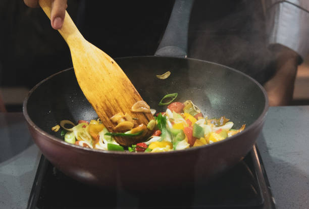 istock Chef preparing food, meal, in the kitchen, chef cooking, Chef decorating dish, closeup, chef at work 1044682724