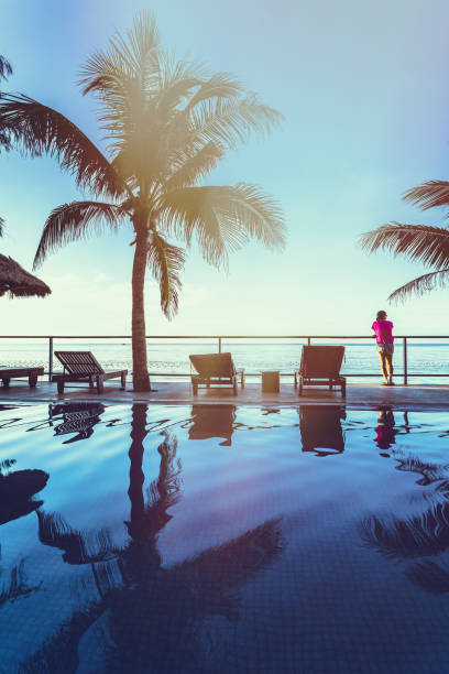 swimming pool and coconut tree at seaside in Vietnam