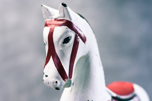 istock Toy rocking white horse on a dark background, close up. 1044689038