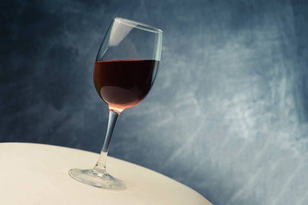 istock Glass of red wine. Beautiful dark background 1044693642
