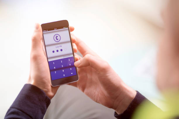 istock Businessman entering password on smart phone 1044697018