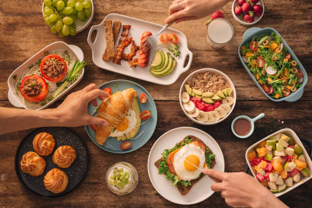 istock Young Happy Family Having Breakfast 1044700172