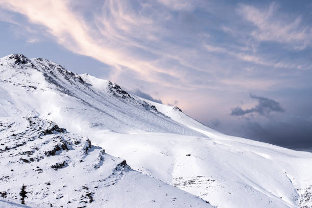 istock Beautiful winter landscape with snow-covered mountains at sunset. 1044703542