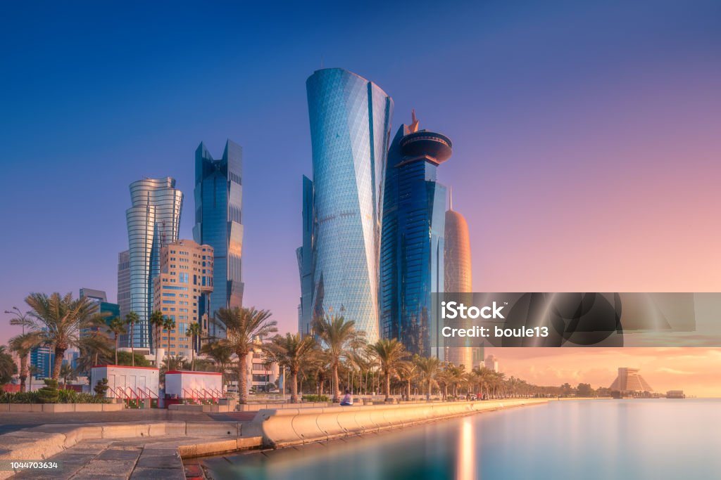 Skyline of West Bay and Doha City Center, Qatar The skyline of West Bay and Doha City Center during sunrise, Qatar. Clipping path of sky Doha Stock Photo