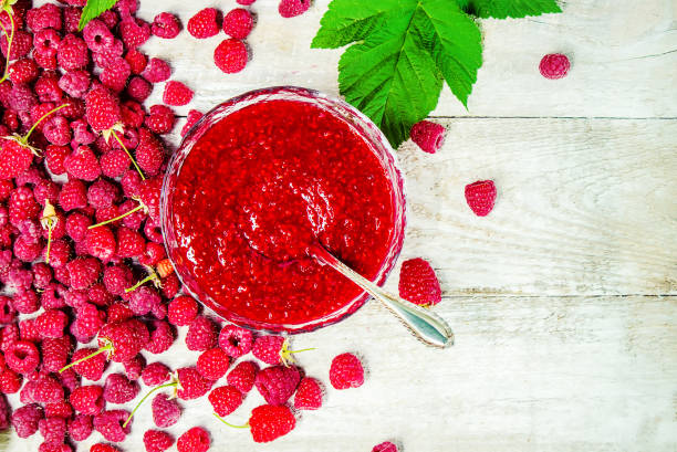 istock Raspberries on a wooden background. Selective focus. 1044704100