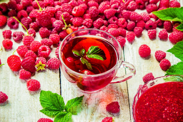 istock Raspberries on a wooden background. Selective focus. 1044704110