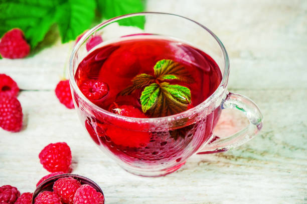 istock Raspberries on a wooden background. Selective focus. 1044704138