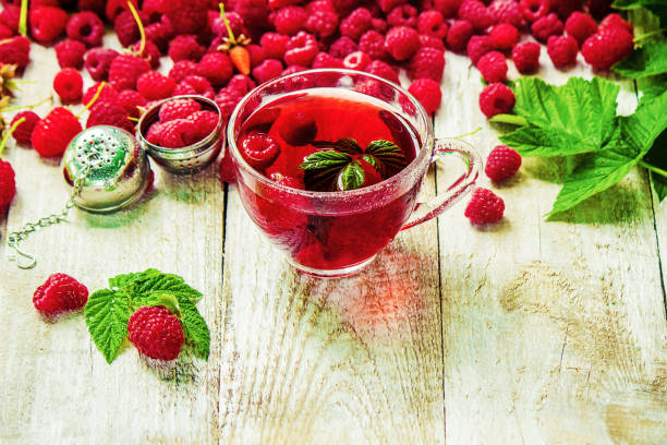 istock Raspberries on a wooden background. Selective focus. 1044704160