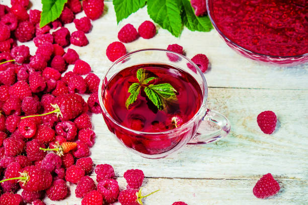 istock Raspberries on a wooden background. Selective focus. 1044704176