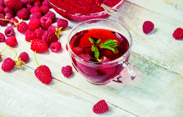 istock Raspberries on a wooden background. Selective focus. 1044704178