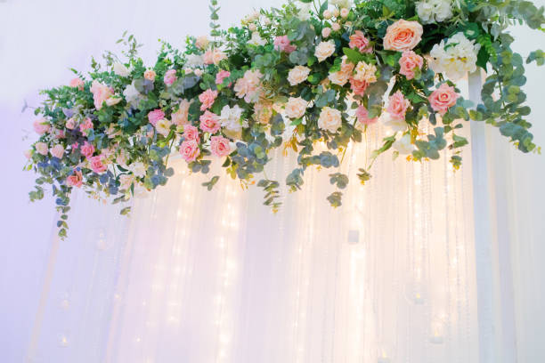istock Wedding in the restaurant. Presidium with beautiful decor - flower compositions and lights. 1044704294