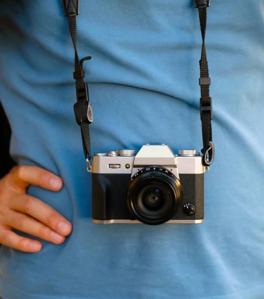 istock tourist man is holding a camera 1044707736