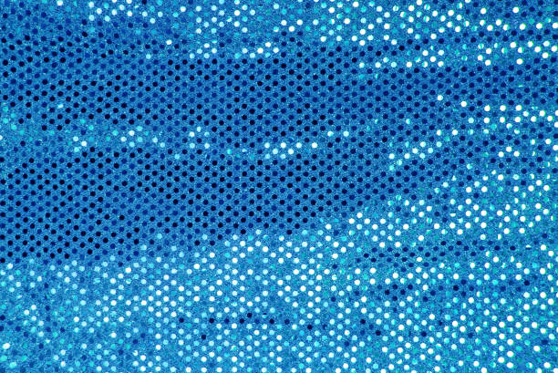 istock Sparkling blue sequin textile background. fabric, sequins on fabric, fabric embroidered sequins 1044710894