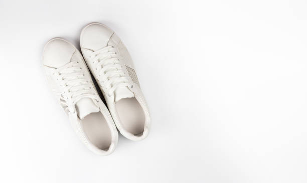 istock White sneaker shoes top view isolated on white background 1044715760