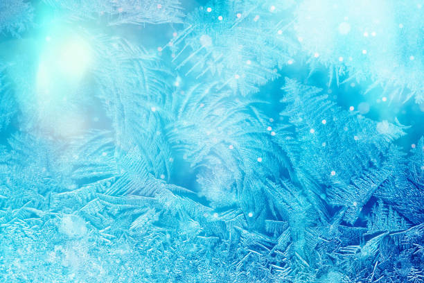Defocused blue background with ice flowers