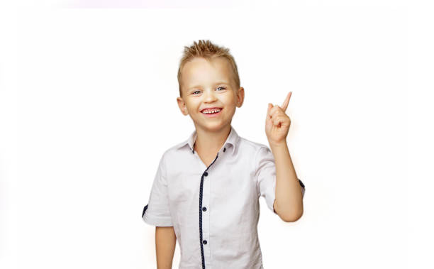 istock Boy in white shirt isolated on white background 1044726374