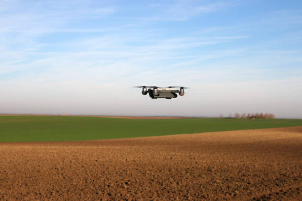 istock The drone is flying over the plowed field agriculture 1044731396