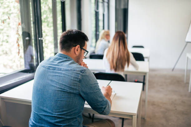 istock College students on the exam. Rear view. 1044732532
