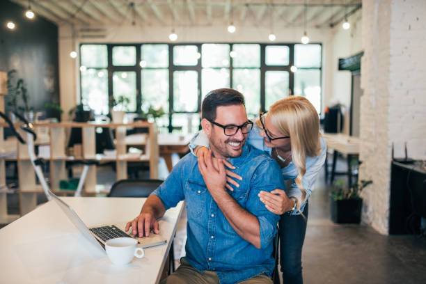 istock Cute casual business couple in creative studio. 1044732566
