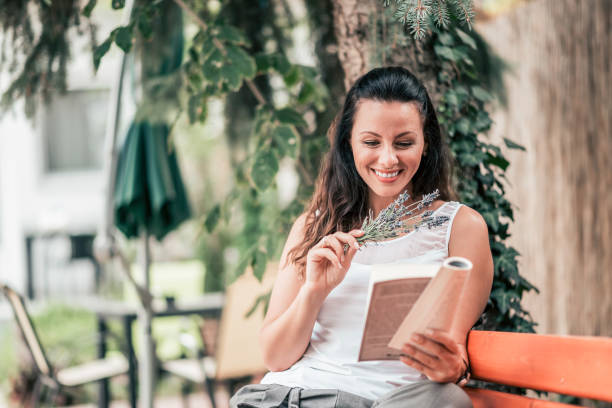 istock Enjoy reading a book outdoors in the city. 1044732622