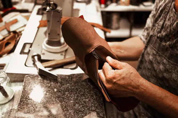 Shoemaker making shoes