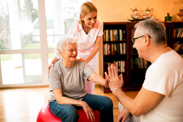 istock Old mature people doing exercises with nurse 1044743208