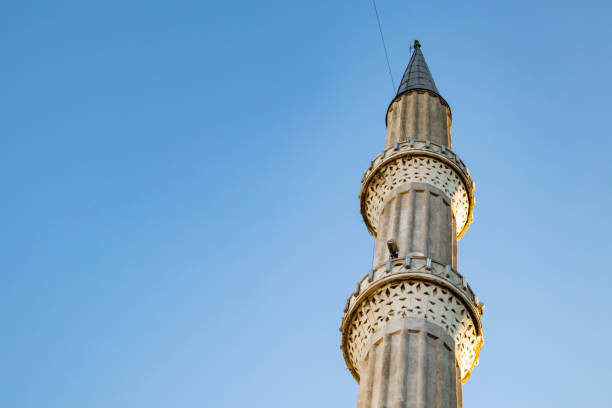 istock mosque minarets and blue sky 1044744410