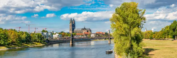 Panoramic view of Elbe, old and new town, bridge in Magdeburg, Germany, Autumn, blue cloudy sky